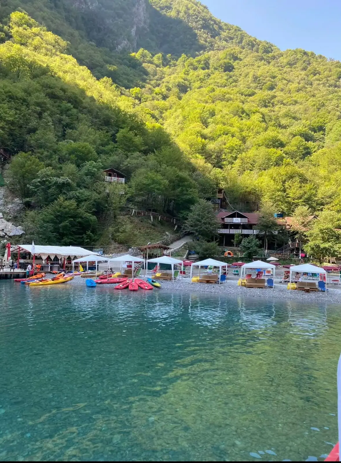 Clear water and a rocky shore on the Shala River